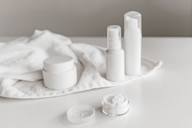 Jars and bottles on a folded white towel